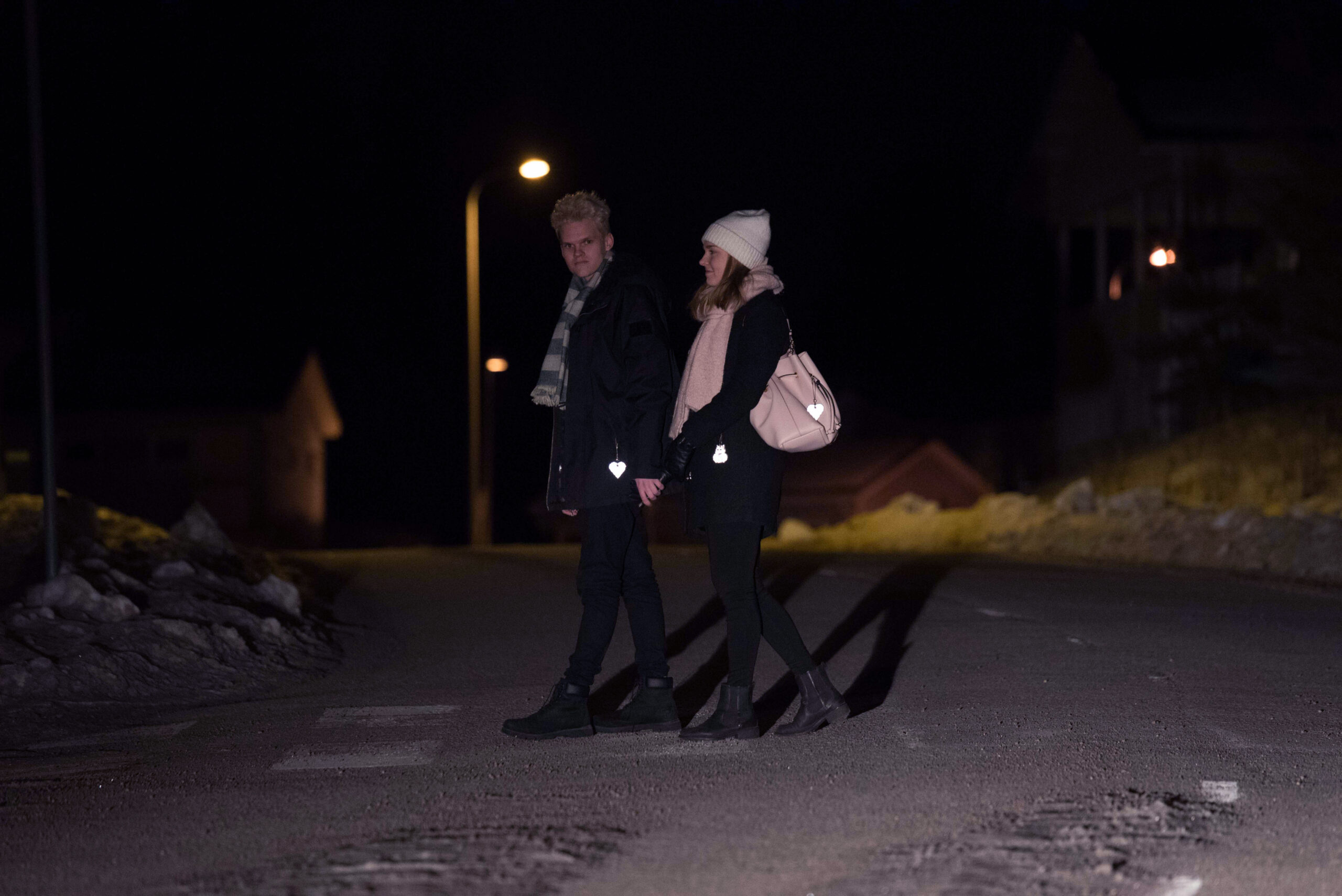 Couple walking on th street safety reflecors scaled 1